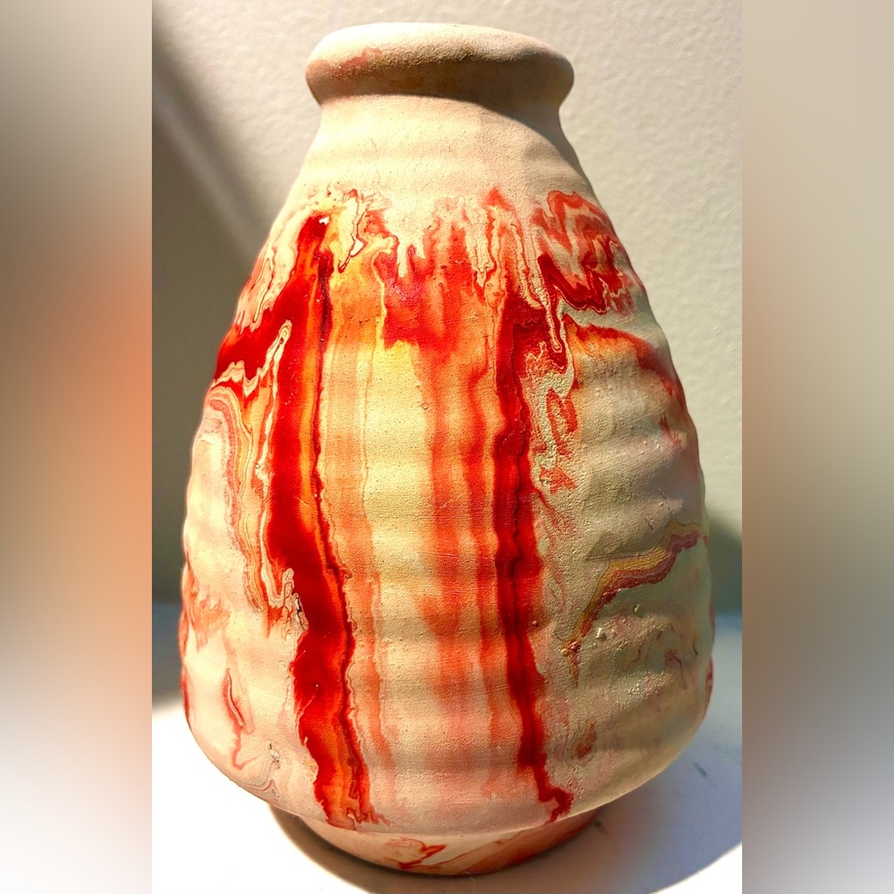 Nemadji Indian Pottery Vase w/ scarlet, & coral marbled swirl design on vanilla